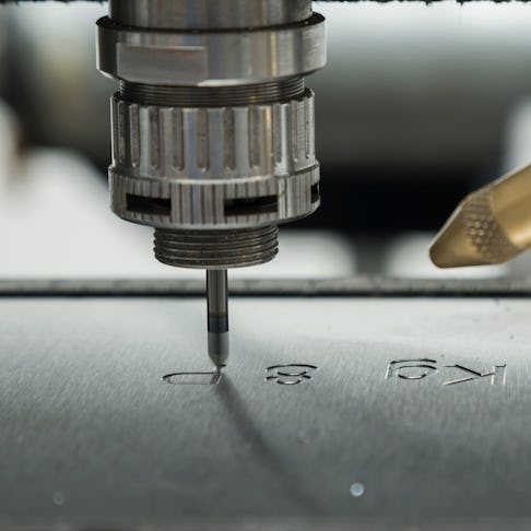 Engraving onto a metal surface. Image Credit: szelltib/Shutterstock.com