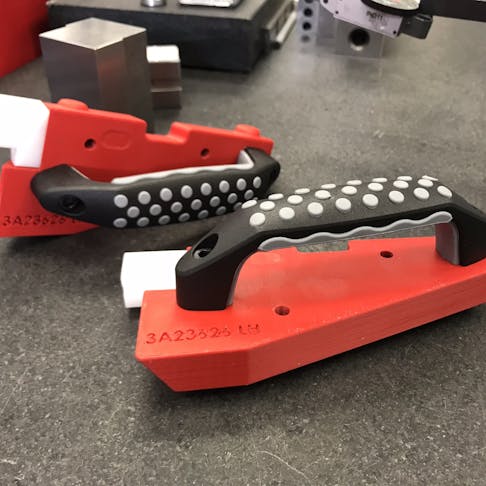 3D printed FDM jig in ABS-M30 red with COTS handle