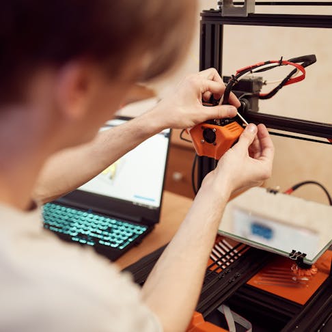 Setting up a 3D printer. Image Credit: Shutterstock.com/Sergey Mironov