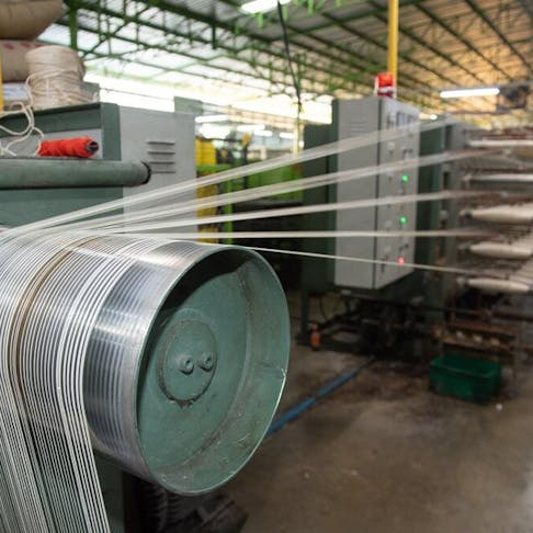 Nylon production in a factory. Image Credit: saravutpics/Shutterstock.com