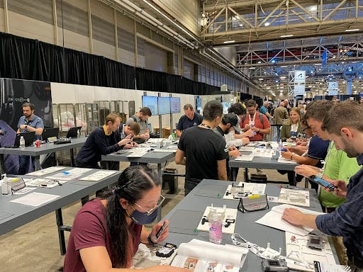 attendees assembling their smart badges 