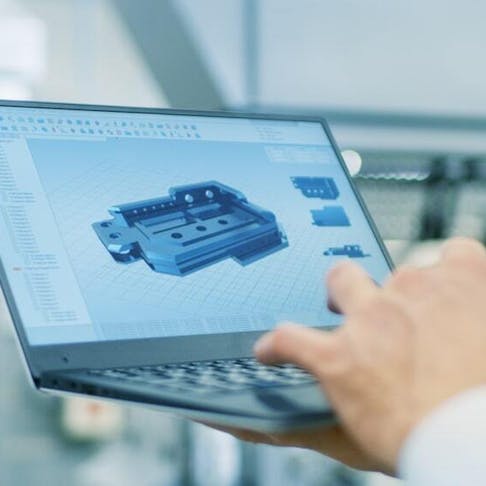 Engineer working with CAD software. Image Credit: Shutterstock.com/Gorodenkoff