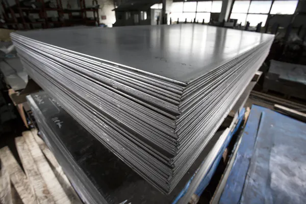 Stack of stainless steel sheets. Image Credit: Shutterstock.com/Alexandru Rosu