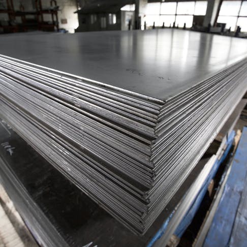 Stack of stainless steel sheets. Image Credit: Shutterstock.com/Alexandru Rosu