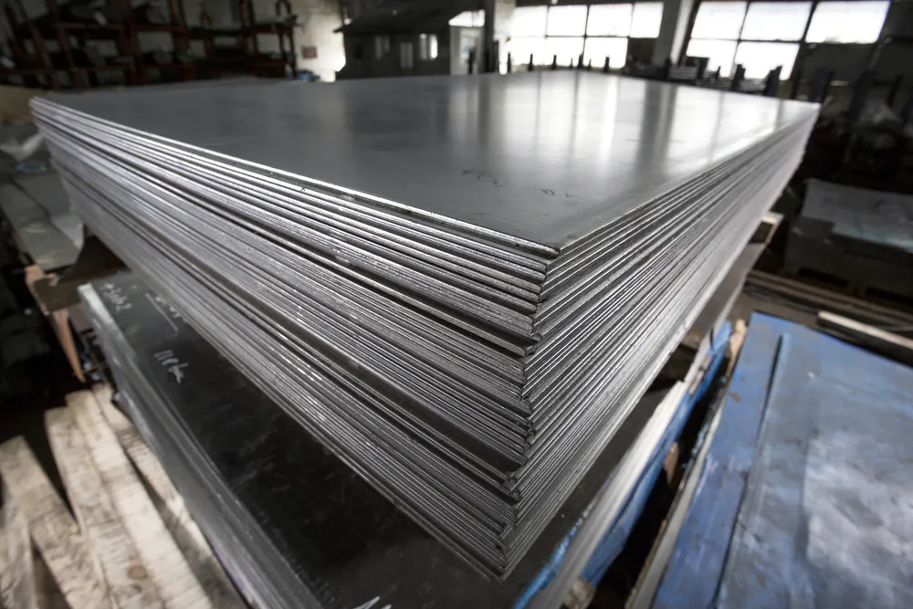Stack of stainless steel sheets. Image Credit: Shutterstock.com/Alexandru Rosu