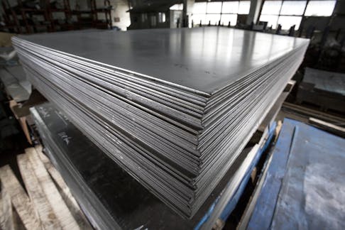Stack of stainless steel sheets. Image Credit: Shutterstock.com/Alexandru Rosu