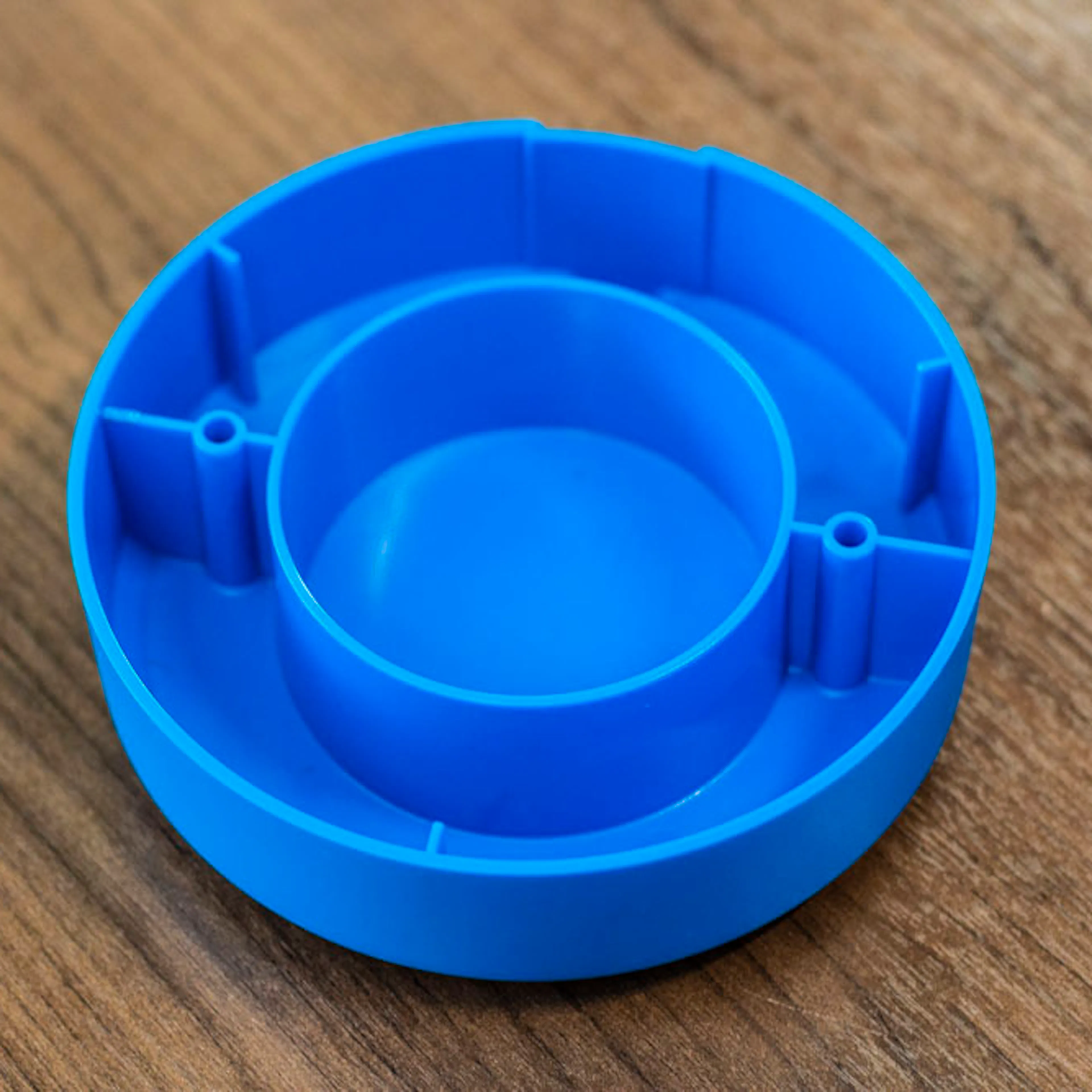 An example of plastic ribs in an blue injection molding part