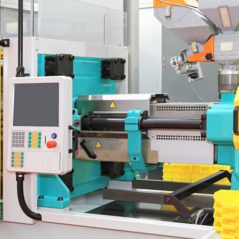 Injection molding machine for plastic parts production. Image Credit: Baloncici/Shutterstock.com