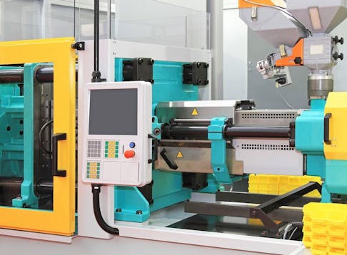 Injection molding machine for plastic parts production. Image Credit: Baloncici/Shutterstock.com