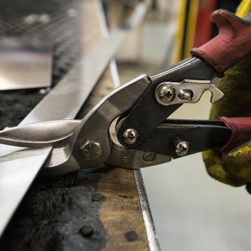 Cutting sheet metal. Image Credit: Shutterstock.com/Akimov Igor