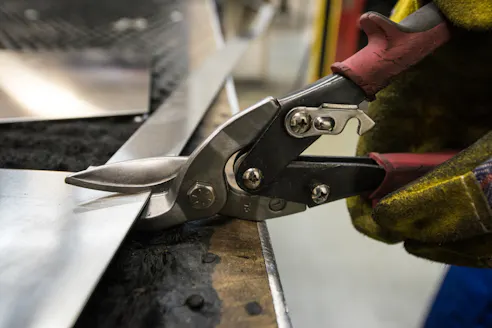 Cutting sheet metal. Image Credit: Shutterstock.com/Akimov Igor