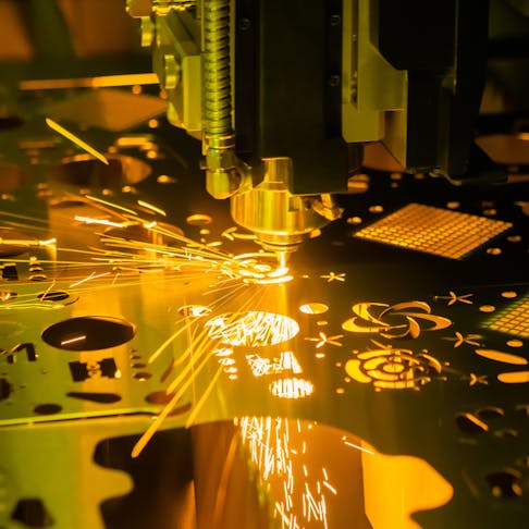 Laser cutting machine in process. Image Credit: Shutterstock.com/Zyabich