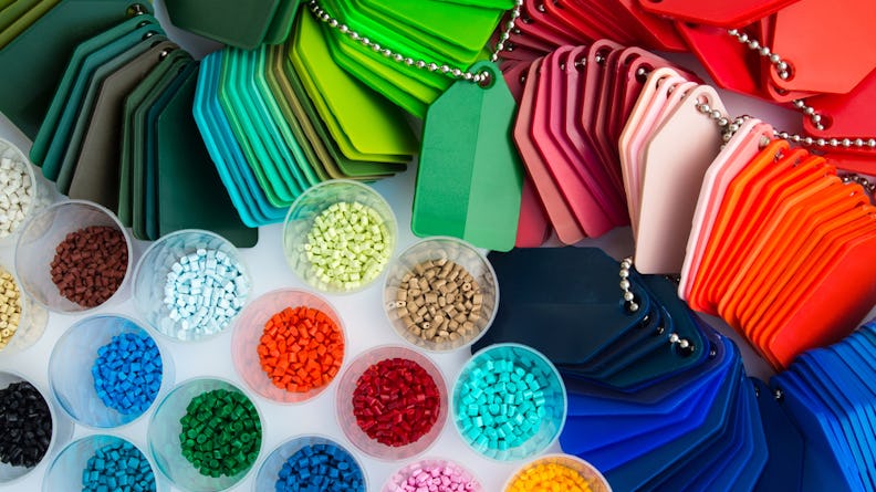 Plastic polymer granules of various colors.