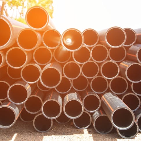 Pile of HDPE pipes. Image Credit: Shutterstock.com/iamzerofighter