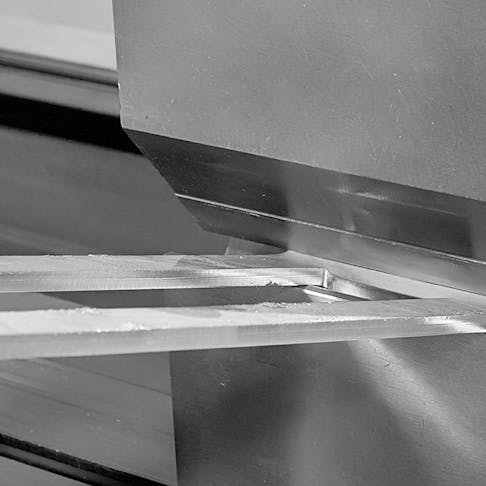 Sheet metal being bent. Image Credit: Shutterstock.com/Dreamsquare