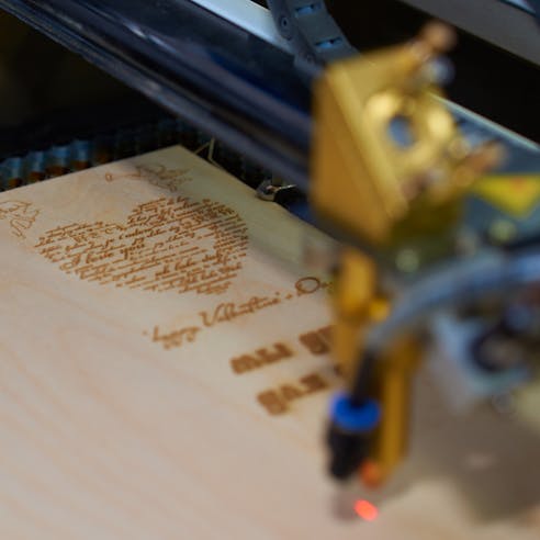 Laser engraving wood. Image Credit: Shutterstock.com/Vinogradova Inna