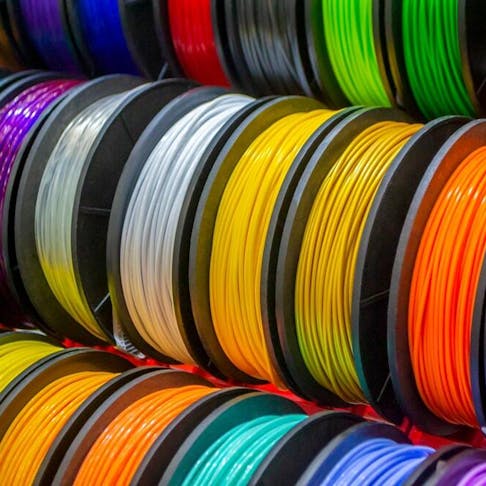 Multicolored filaments for plastic 3D printing. Image Credit: Shutterstock.com/MarinaGrigorivna