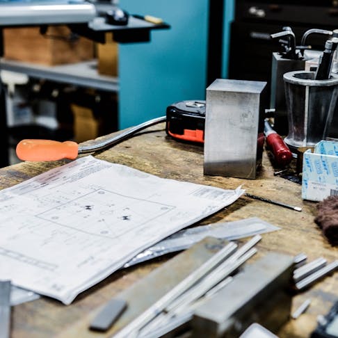 drawings and parts on a table