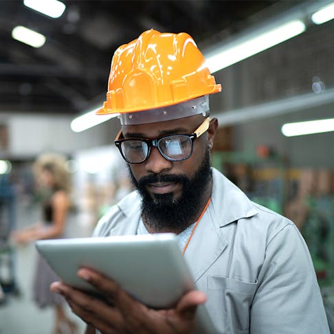 man looking at tablet