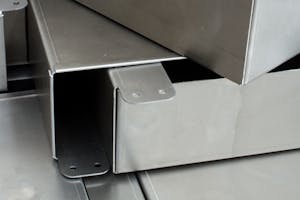Sheet metal parts with hems and other formed features.