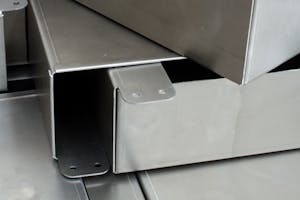 Sheet metal parts with hems and other formed features.