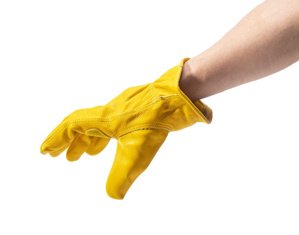 yellow leather glove on white background