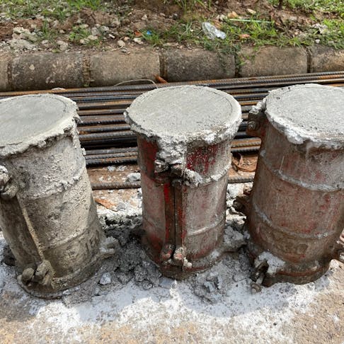 Concrete cylinders for compressive strength testing. Image Credit: Shutterstock.com/Tegar Pict