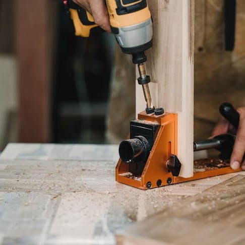 Drill bit and centering dowel jig. Image Credit: Shutterstock.com/kasarp studio