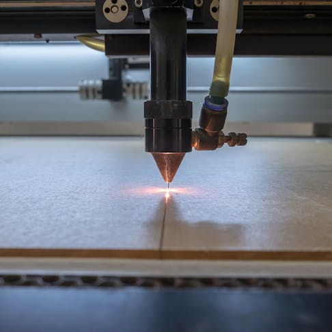 Laser cutting machine carving patterns. Image Credit: Shutterstock.com/John99