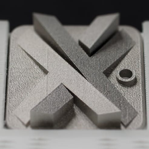 metal printed Xometry "X"
