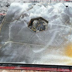 AR steel plate being waterjet cut using Xometry's Waterjet cutting service.