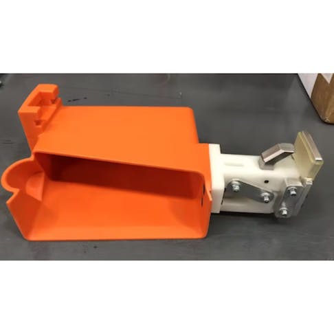 A Xometry-manufactured fixture used for the assembly of electrical components in hybrid electric vehicles. The assembly consists of a mix of urethane molded parts and CNC parts and is produced cost-effectively in one-off or with short runs.