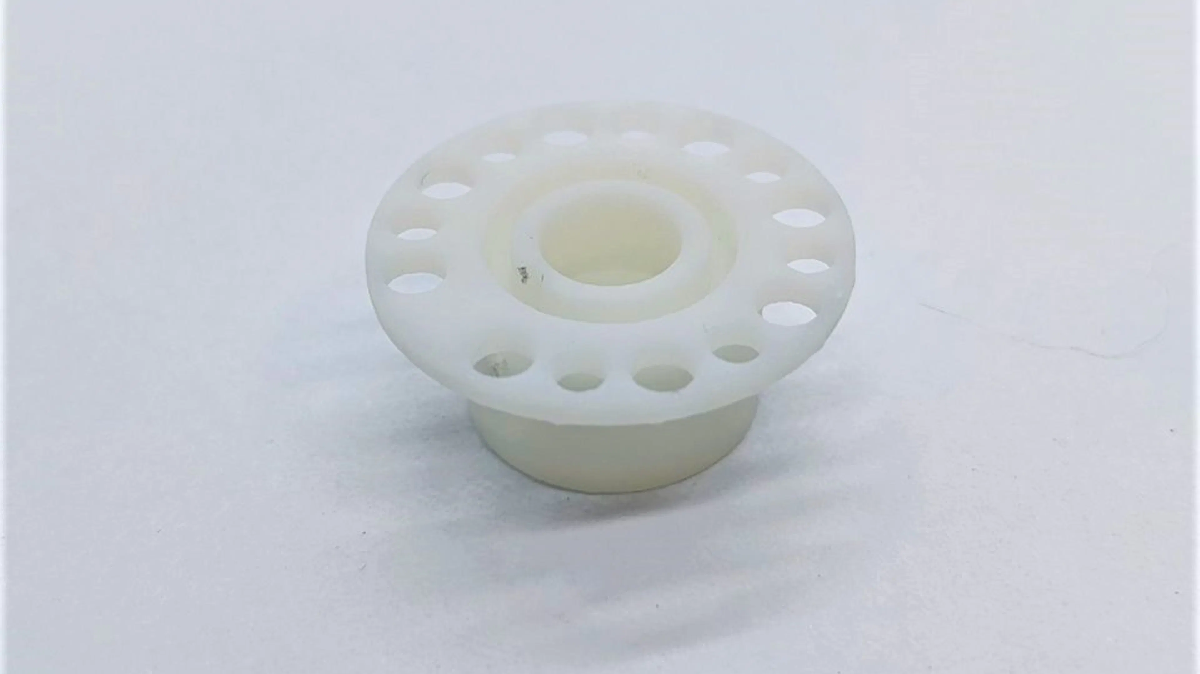 This is the 3D printed Somos PerFORM insulator. 