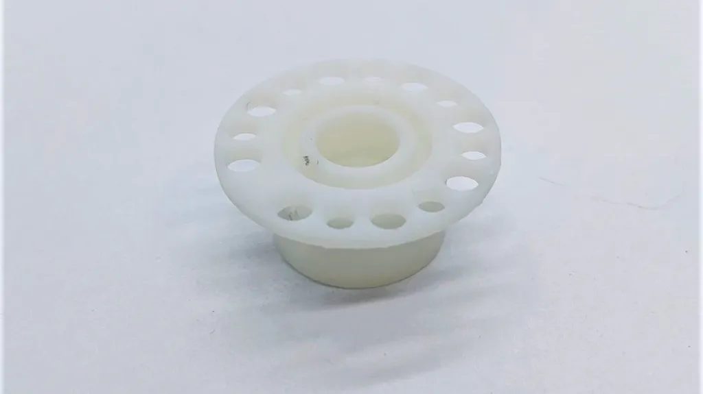 This is the 3D printed Somos PerFORM insulator.