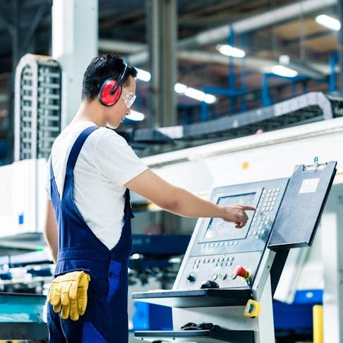 CNC Machinist. Image Credit: Shutterstock.com/Kzenon