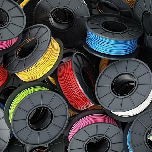 Stack of colorful 3D printer filaments. Image Credit: Shutterstock.com/cigdem