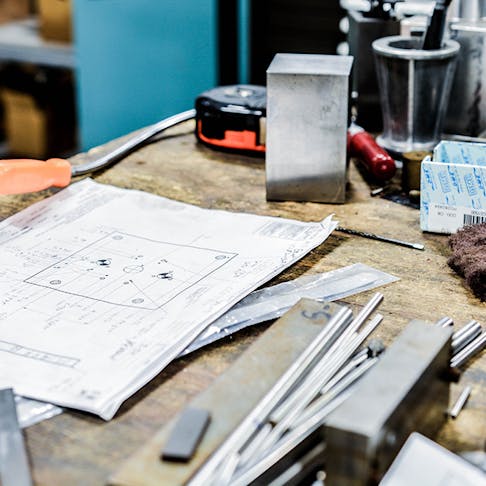 parts and drawings on a table