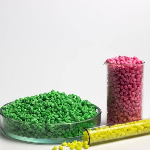 Green, yellow and pink granules of polypropylene. Image Credit: Shutterstock.com/Anastasiia Burlutskaia