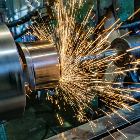 Grinding cylindrical part. Image Credit: Shutterstock.com/Dovzhykov Andriy