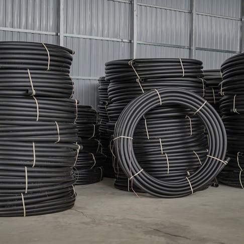 HDPE pipes rolled up. Image Credit: Shutterstock.com/Piseth Phay