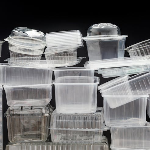 Clear plastic boxes for food packaging. Image Credit: Shutterstock.com/Konektus Photo