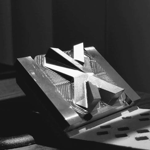 Metal CNC machined X tile