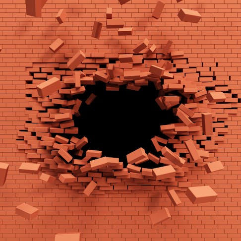 Burst strength on brick wall. Image Credit: Shutterstock.com/Kutlayev Dmitry