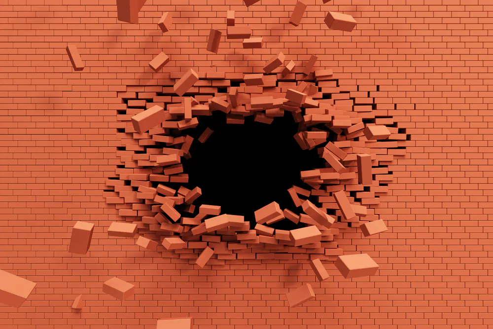 Burst strength on brick wall. Image Credit: Shutterstock.com/Kutlayev Dmitry
