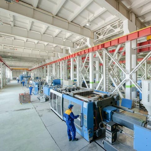 industrial mold press machine for manufacturing plastic parts. Image Credit: Alba_alioth/Shutterstock.com