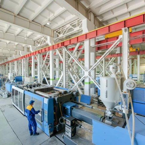 Injection molding press machine. Image Credit: Shutterstock.com/Alba_alioth