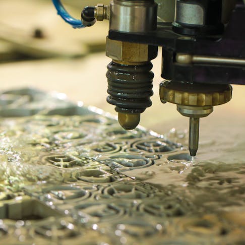 Waterjet cutting machine. Image Credit: Shutterstock.com/PHATRAWUTH EAWCHAREON