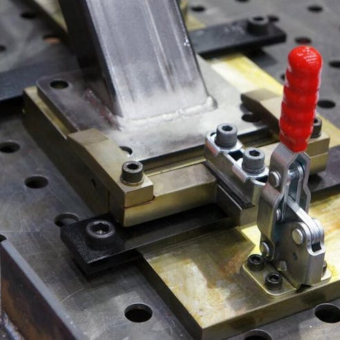 Close up of clamping jig with manual quick clamp. Image Credit: Shutterstock.com/SHINPANU