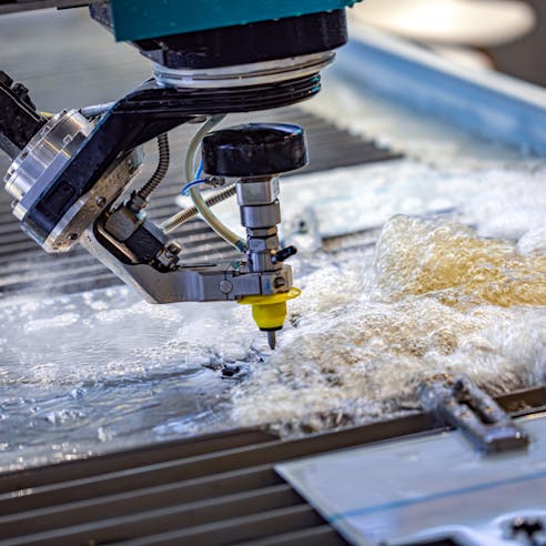 Waterjet cutting machine. Image Credit: Shutterstock.com/Andrei Armiagov