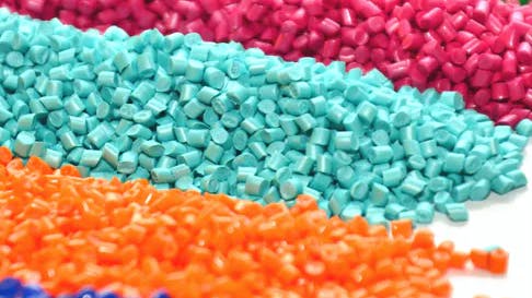Plastic resin material in various colors.